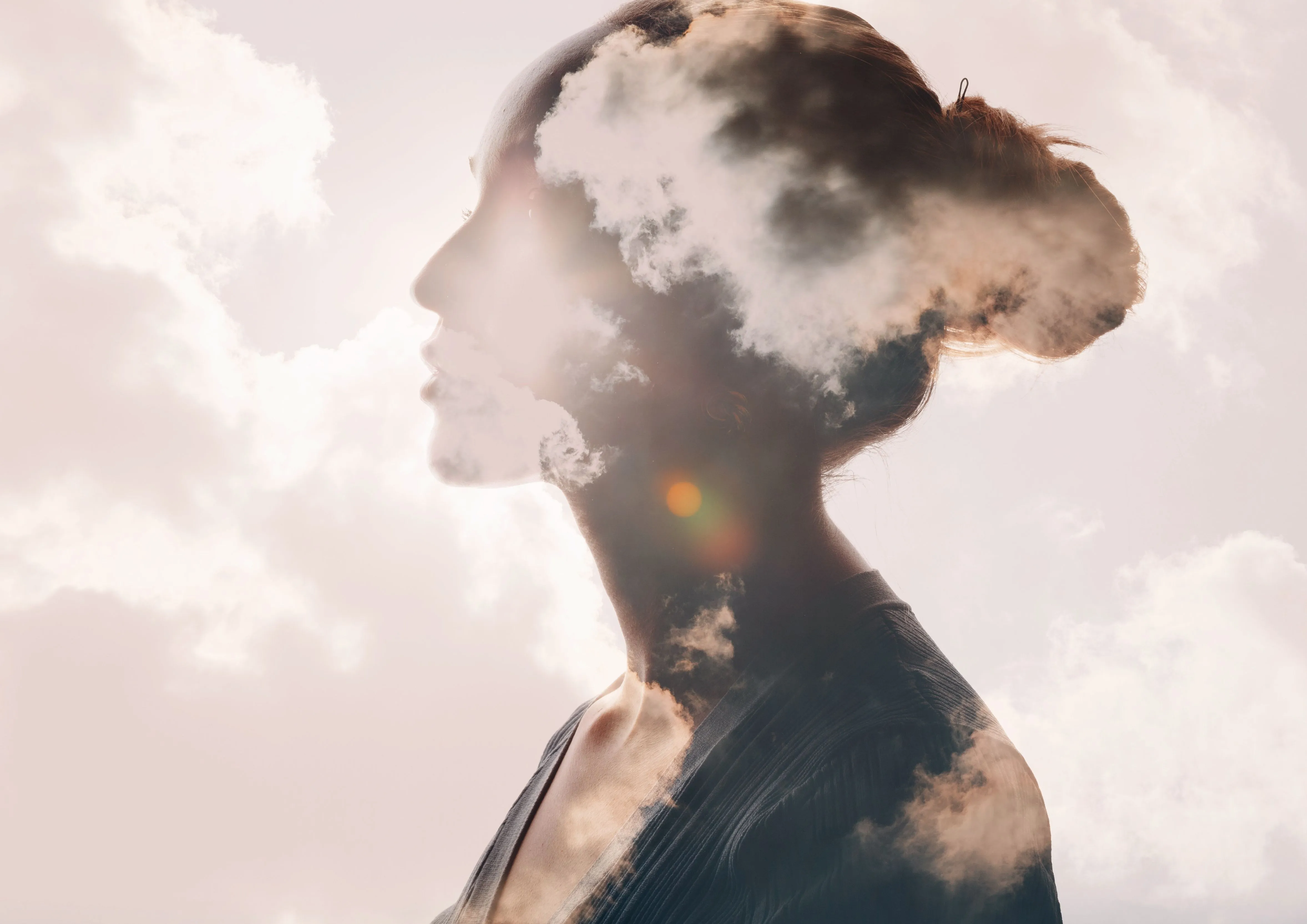 An image of a woman with clouds over her head